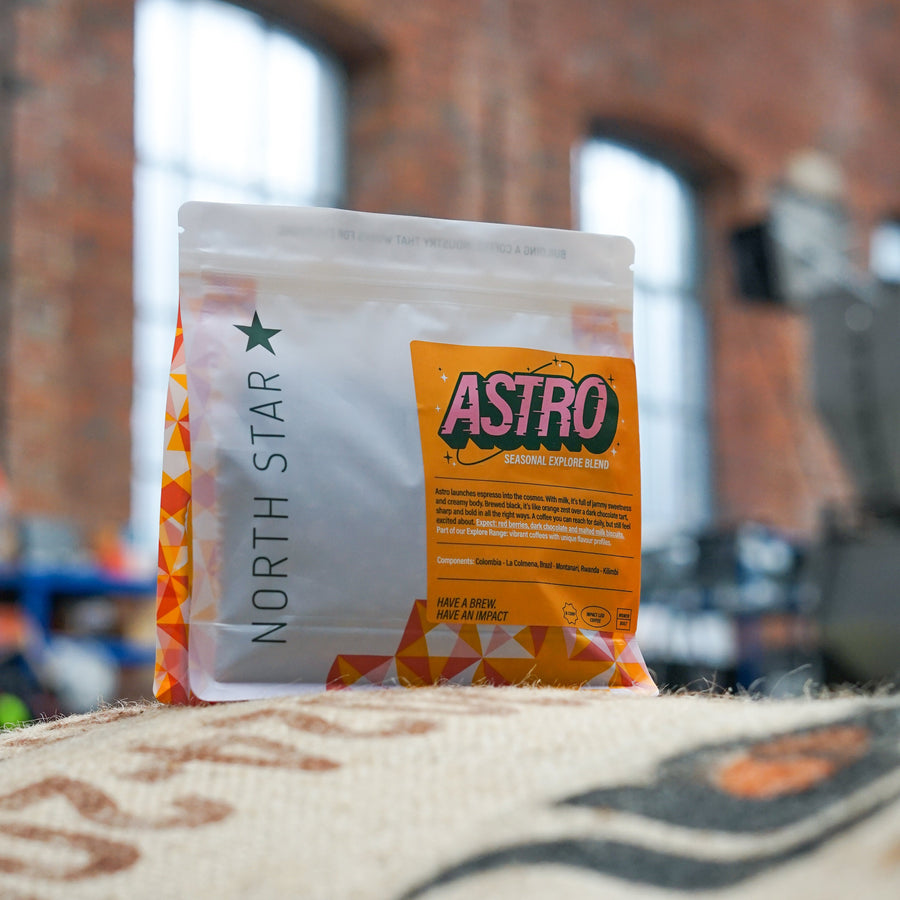 North Star Astro product packaging on a textured surface with a blurred brick wall background